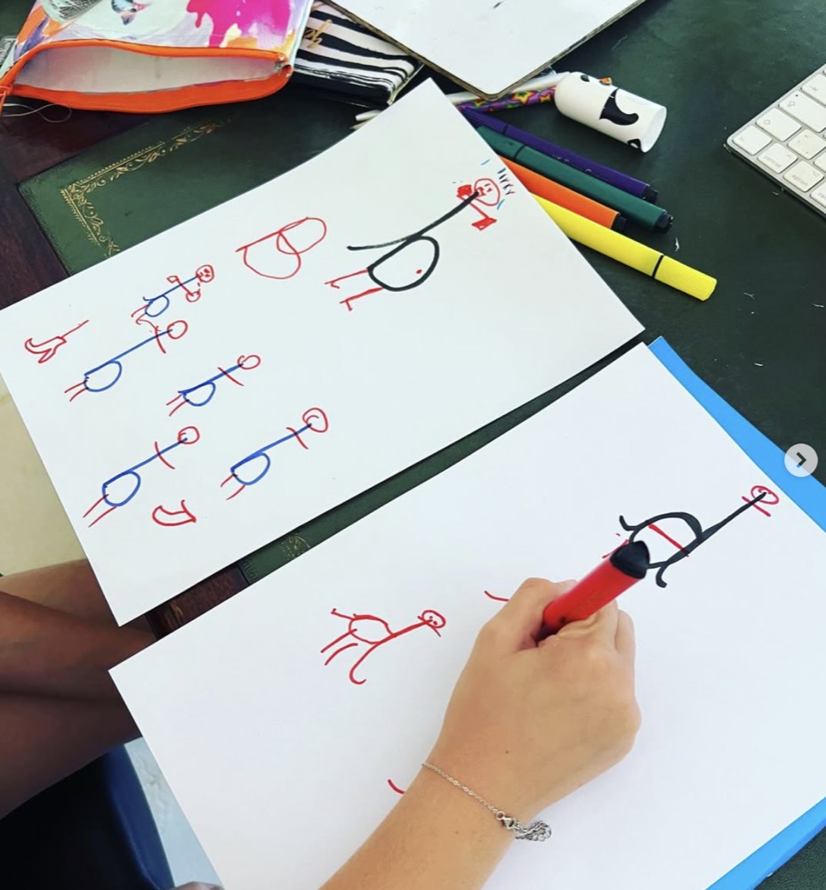 A child practising letter formation, working through b and d reversals